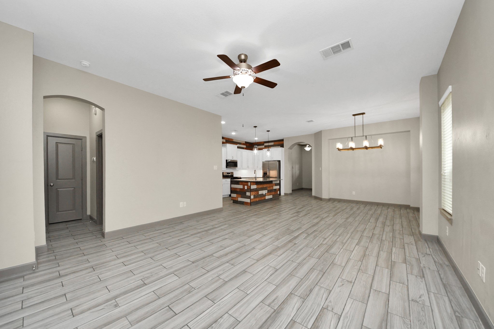 211 Pleasant Hill Way Conroe, TX 77304 - Photo 23 of 50 a view of a livingroom with a workspace