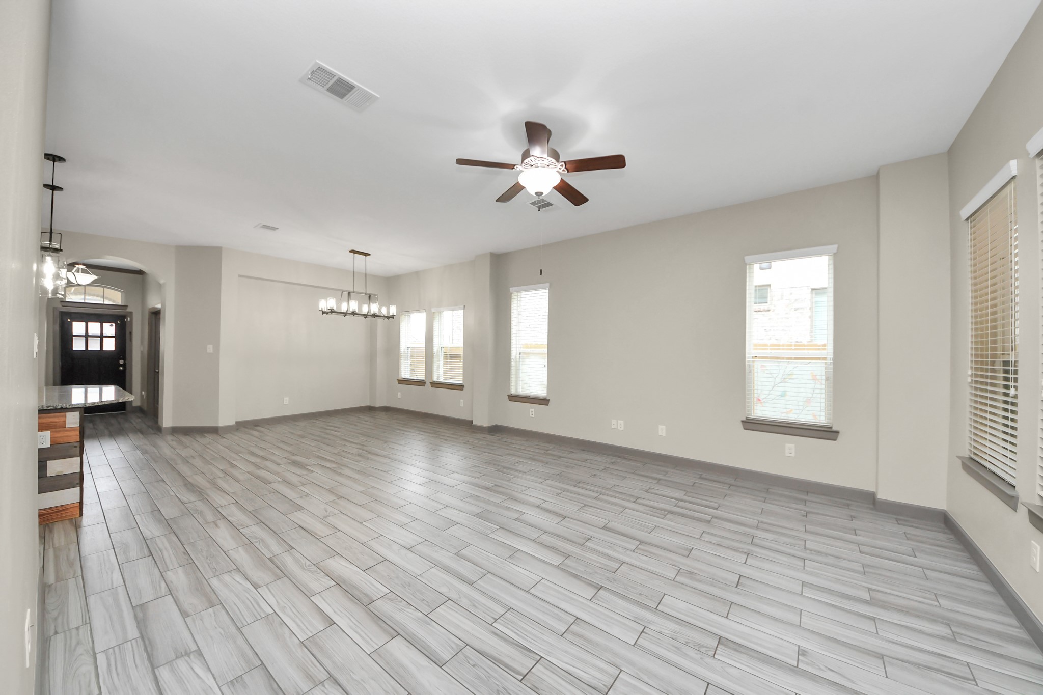 211 Pleasant Hill Way Conroe, TX 77304 - Photo 24 of 50 a view of empty room with wooden floor and fan