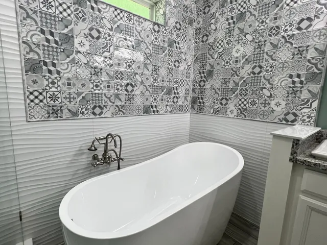 a white bath tub sitting in a bathroom