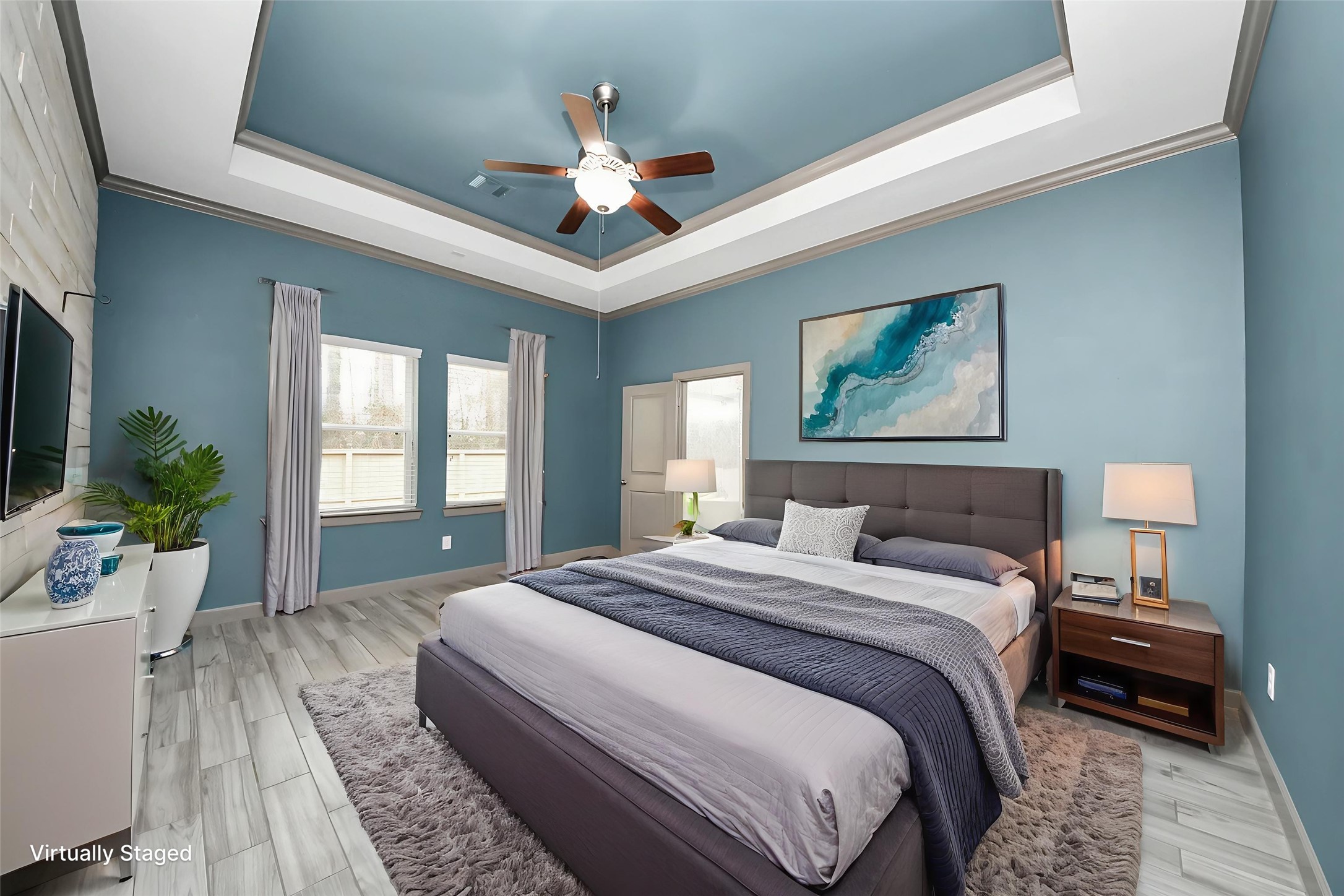 211 Pleasant Hill Way Conroe, TX 77304 - Photo 26 of 50 a bedroom with a large bed and a chandelier