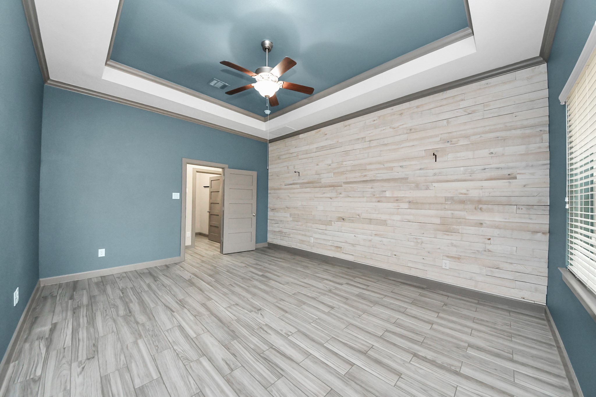 211 Pleasant Hill Way Conroe, TX 77304 - Photo 28 of 50 wooden floor in an empty room with a window