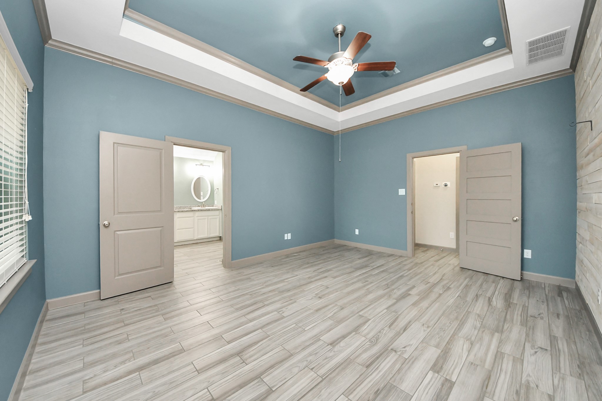 211 Pleasant Hill Way Conroe, TX 77304 - Photo 29 of 50 wooden floor in an empty room with a window