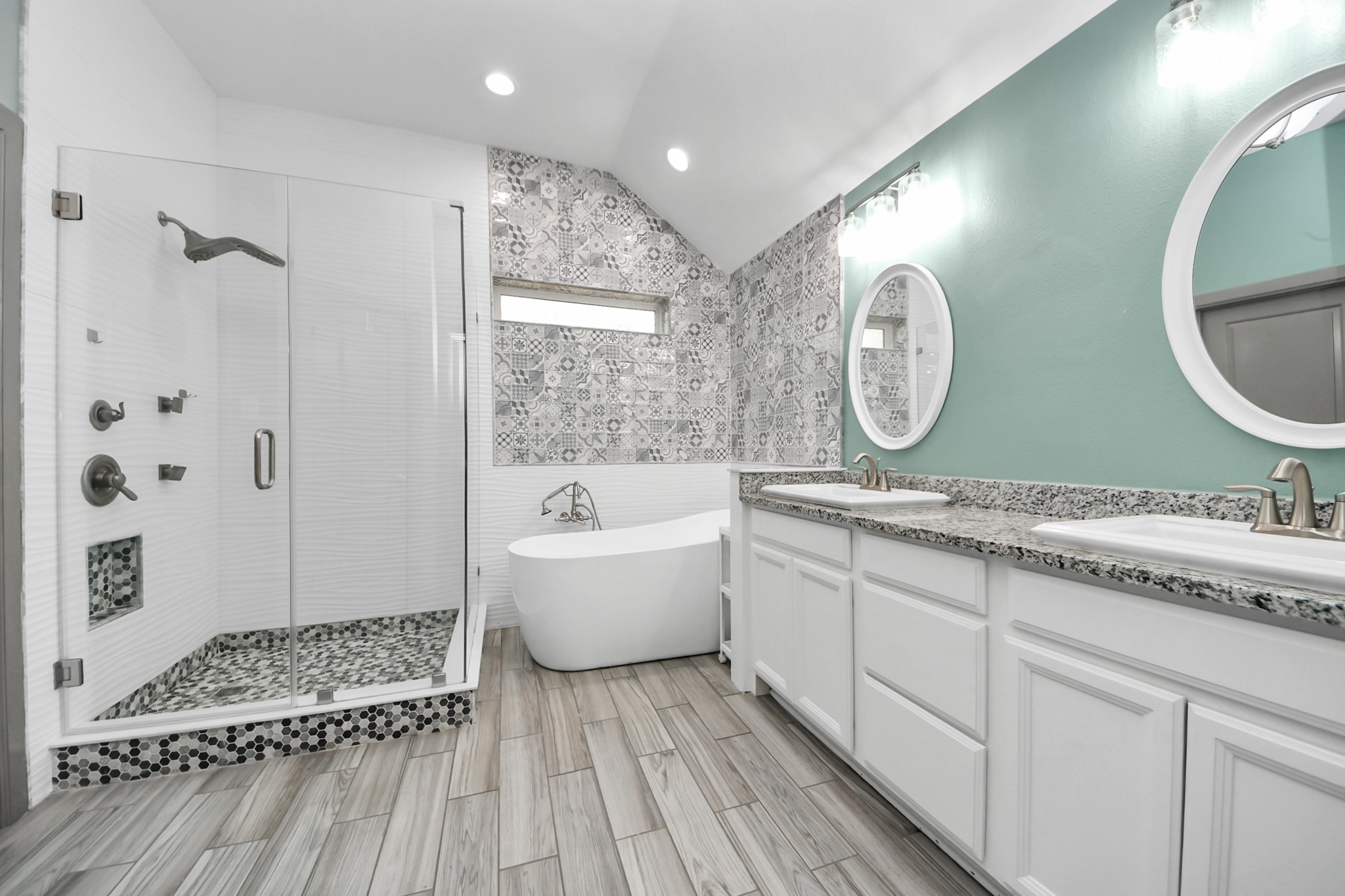 211 Pleasant Hill Way Conroe, TX 77304 - Photo 30 of 50 a bathroom with a double vanity sink mirror and shower