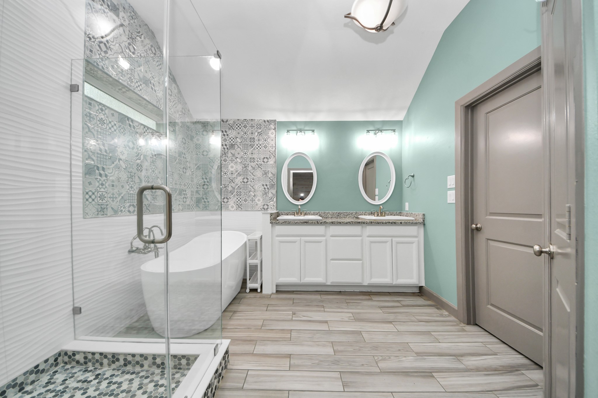 211 Pleasant Hill Way Conroe, TX 77304 - Photo 31 of 50 a bathroom with a sink a toilet and a mirror