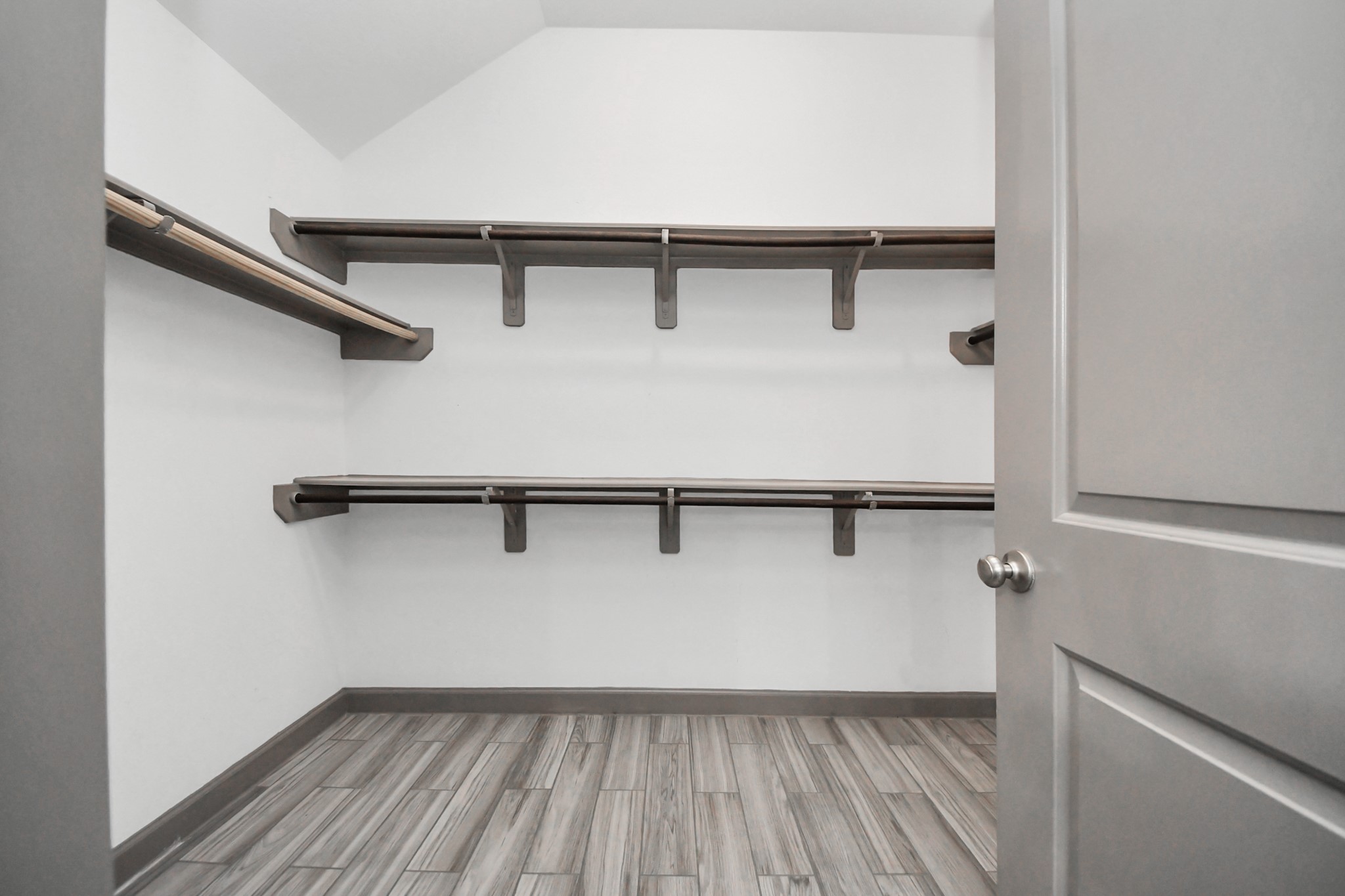 211 Pleasant Hill Way Conroe, TX 77304 - Photo 32 of 50 a view of a room with racks on the wall