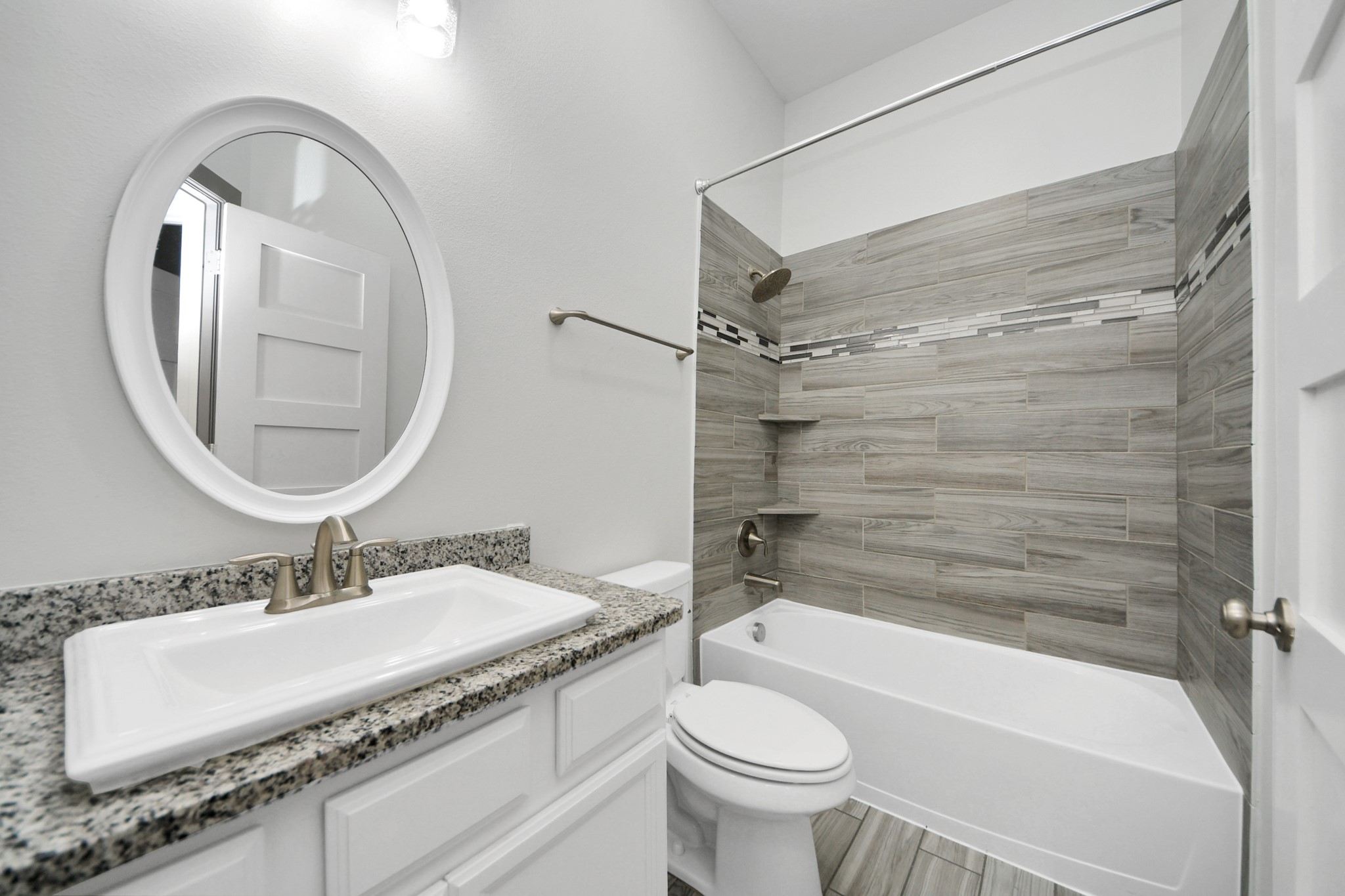 211 Pleasant Hill Way Conroe, TX 77304 - Photo 36 of 50 a bathroom with a granite countertop sink toilet and shower