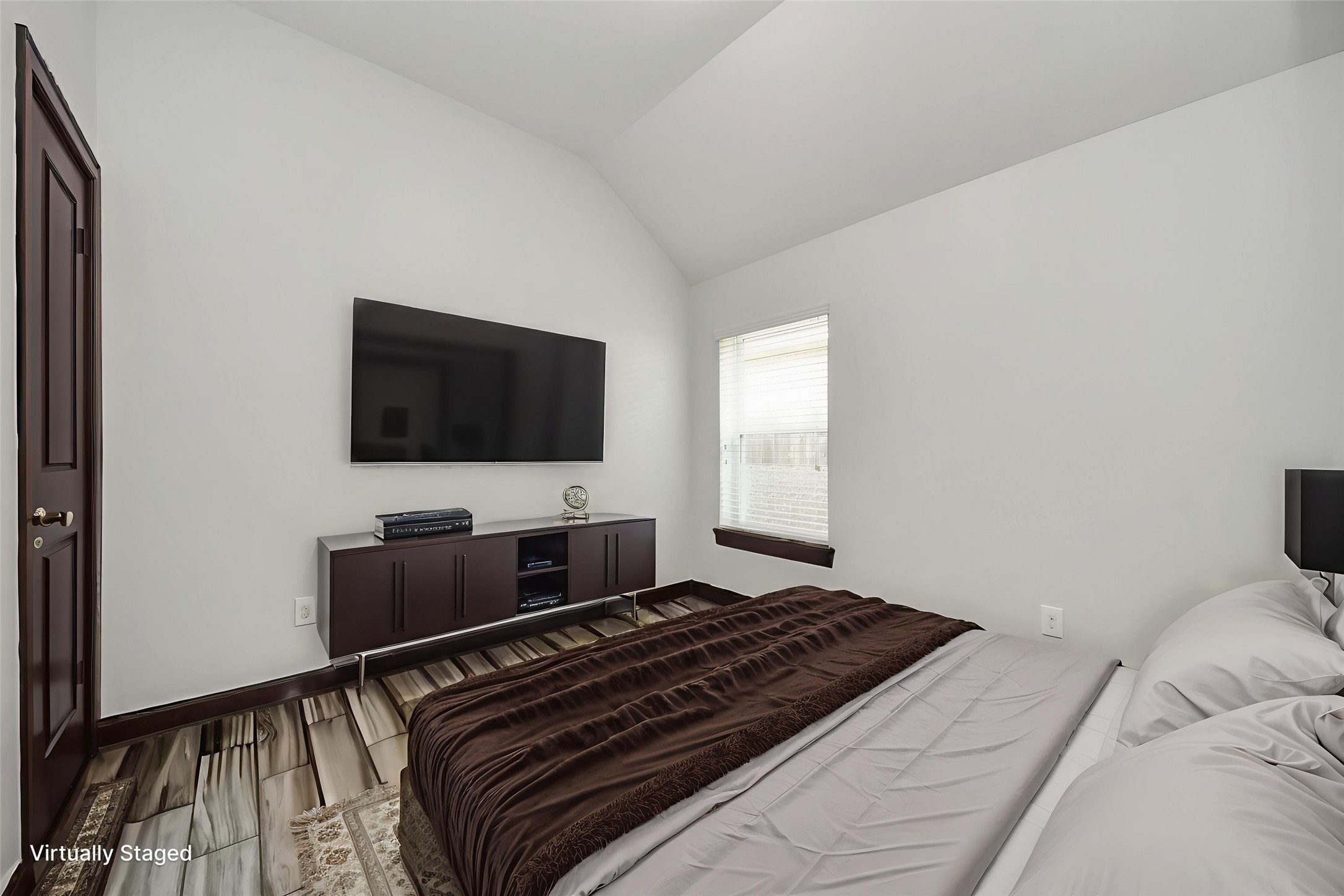 211 Pleasant Hill Way Conroe, TX 77304 - Photo 38 of 50 a bedroom with a bed and a flat screen tv