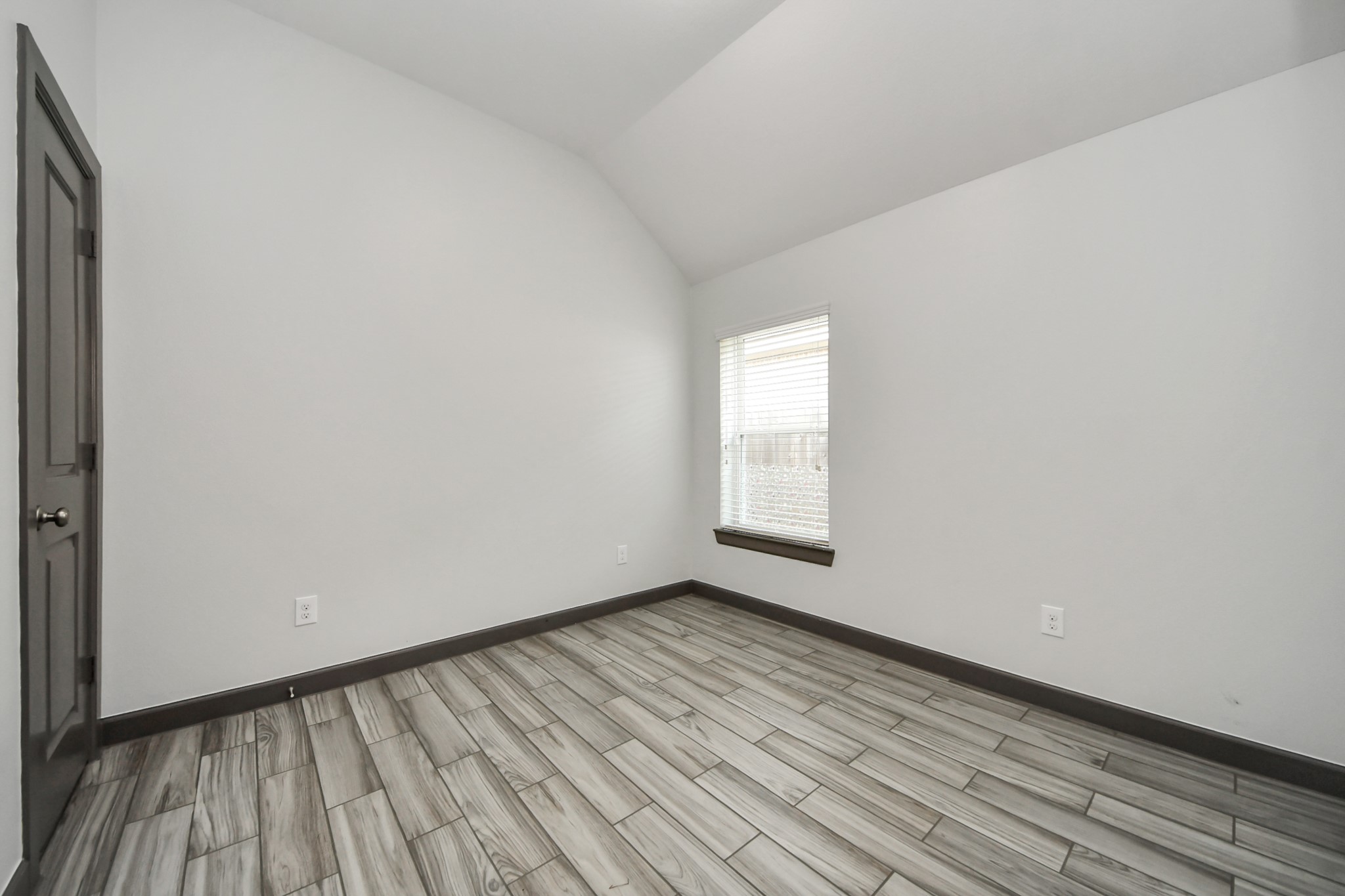 211 Pleasant Hill Way Conroe, TX 77304 - Photo 39 of 50 a view of an empty room and window