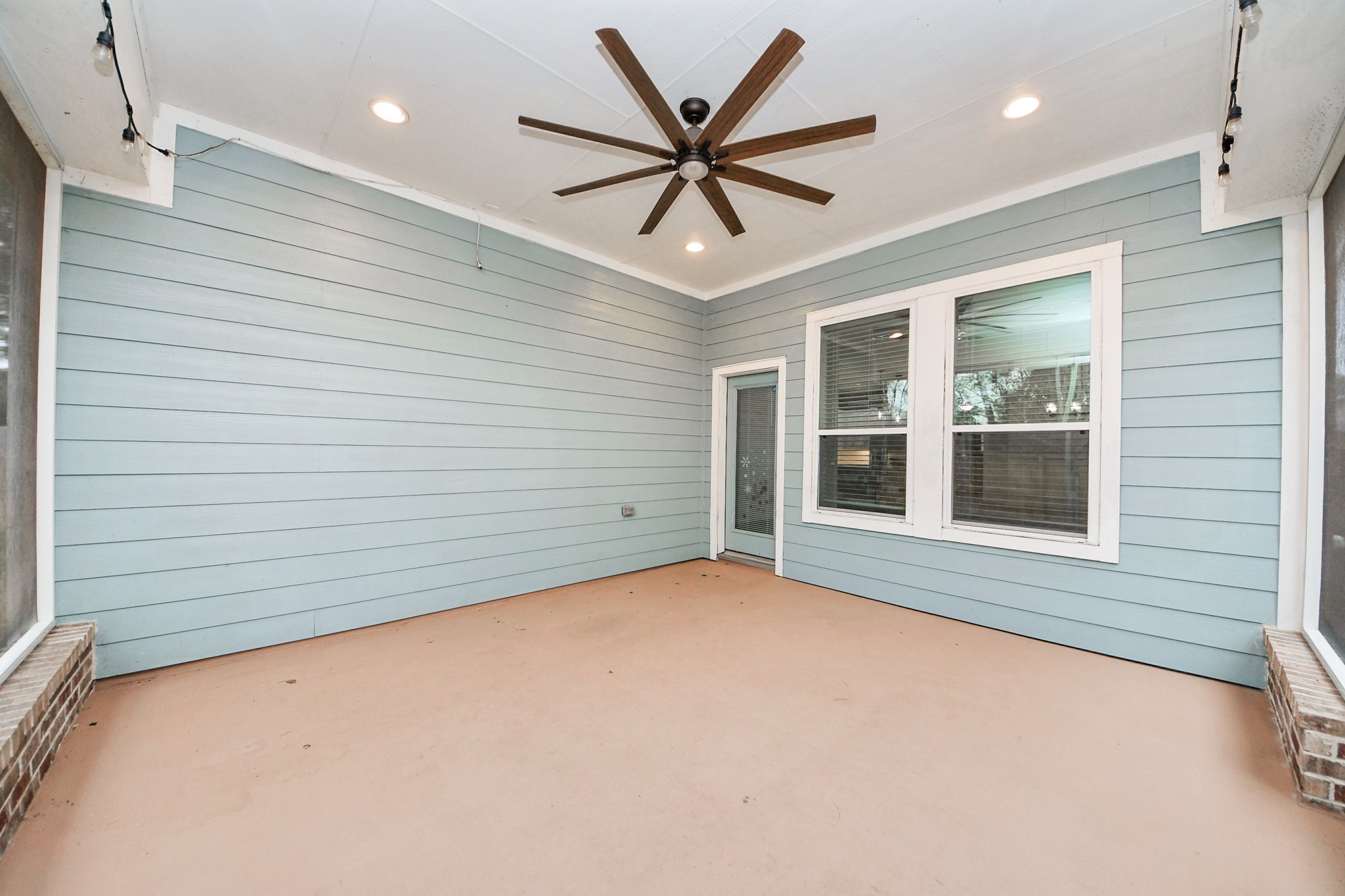 211 Pleasant Hill Way Conroe, TX 77304 - Photo 44 of 50 a view of an empty room with a window and a ceiling fan