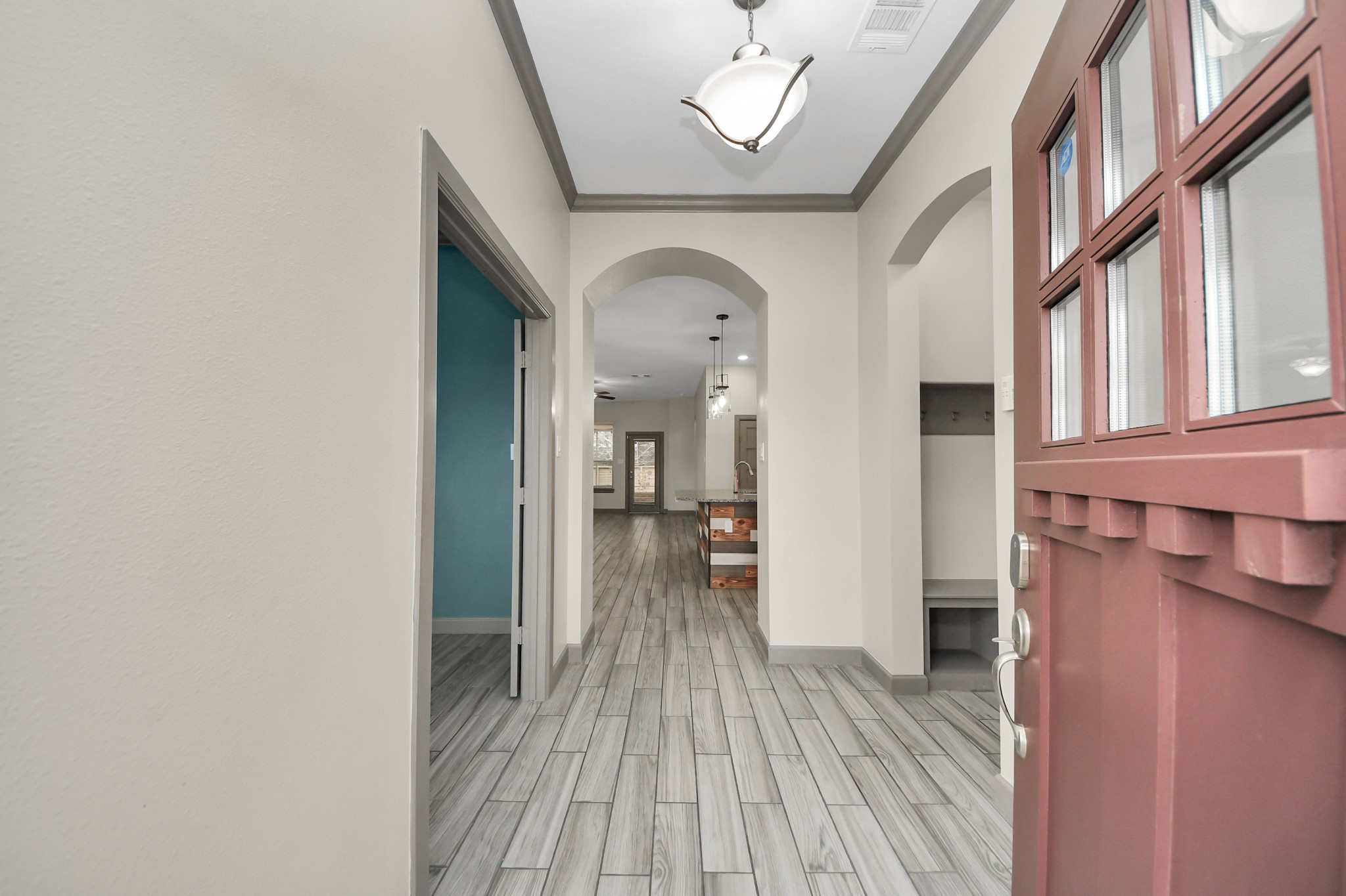 211 Pleasant Hill Way Conroe, TX 77304 - Photo 5 of 50 a view of a hallway with wooden floor and staircase