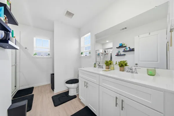 a bathroom with a bathtub and a shower