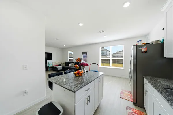 a view of living room with furniture and window