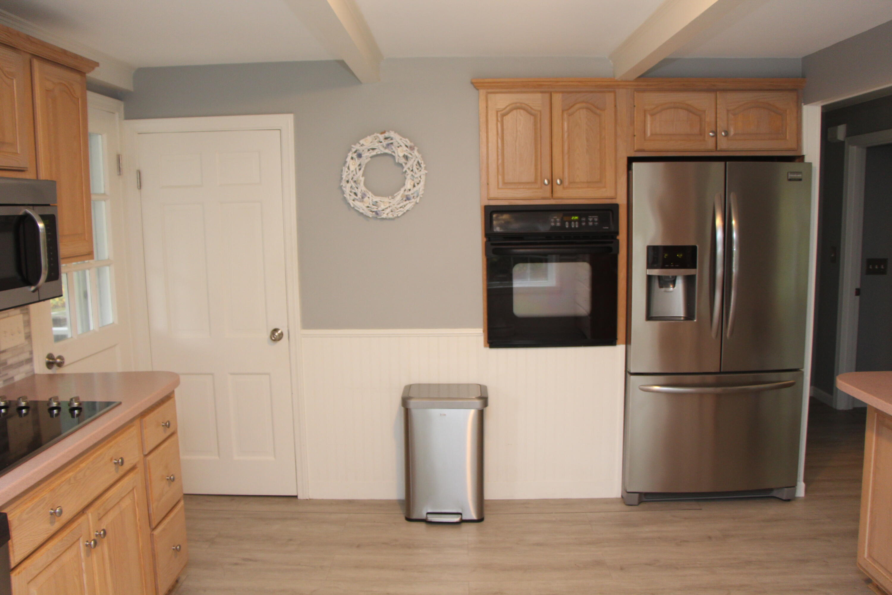 26 Murval Road Pocasset, MA 02559 - Photo 14 of 29 a kitchen with stainless steel appliances granite countertop a refrigerator and a stove top oven