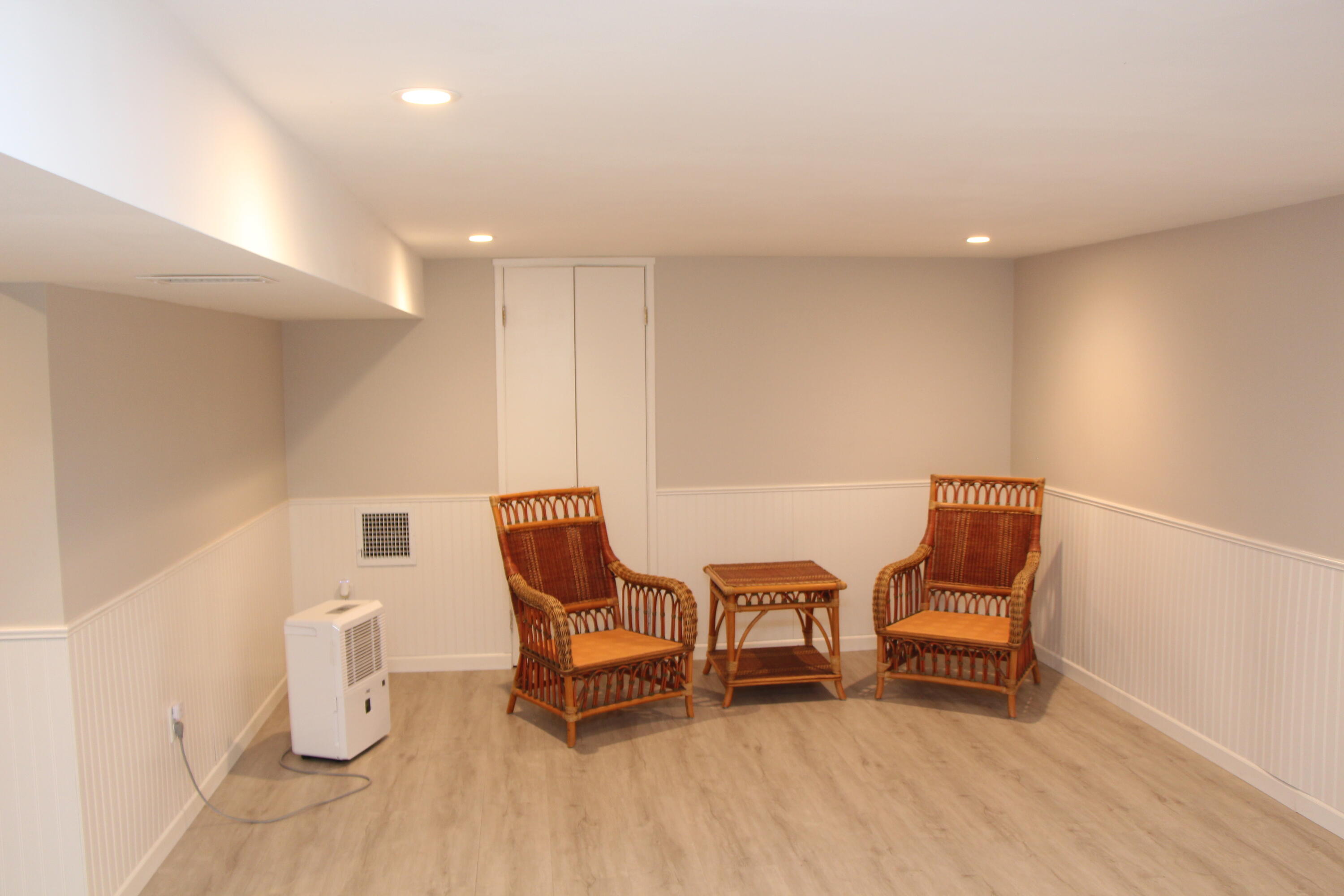 26 Murval Road Pocasset, MA 02559 - Photo 29 of 29 a living room with furniture and a chair