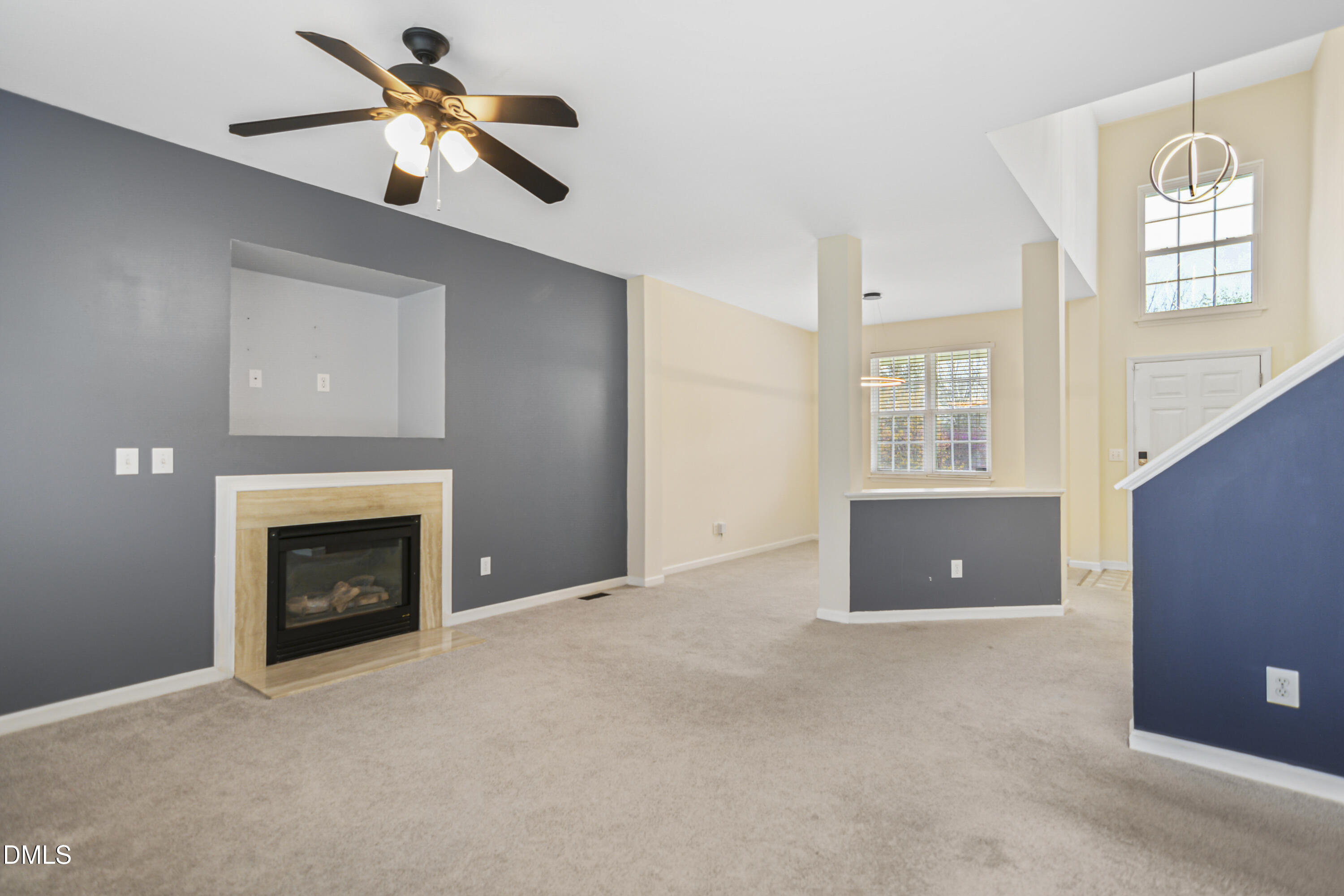 2241 Spruce Shadows Lane Raleigh, NC 27614 - Photo 6 of 29 a view of livingroom with a fireplace and window