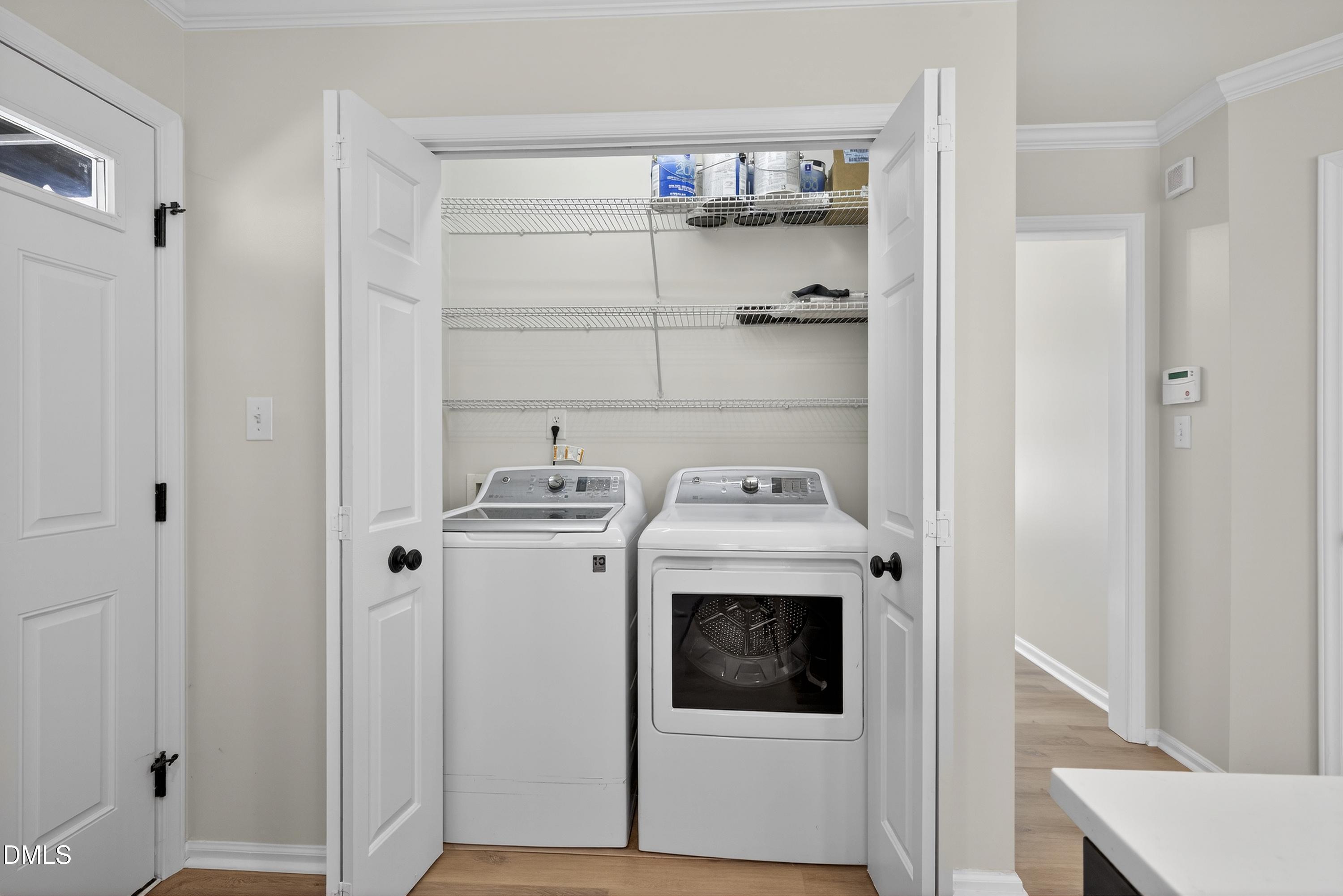 6009 Sweden Drive Raleigh, NC 27612 - Photo 11 of 38 a view of a storage and utility room with washer and dryer