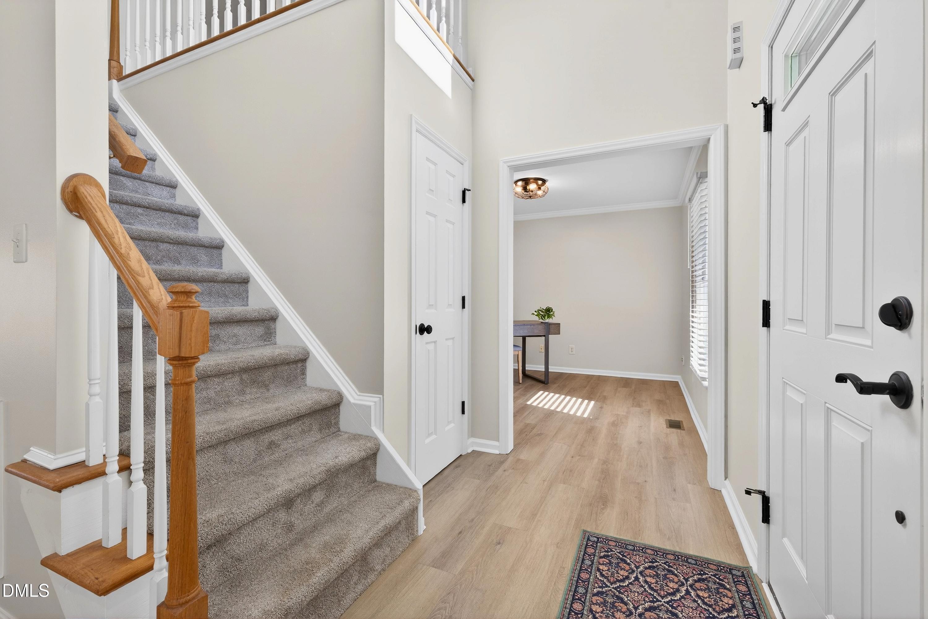 6009 Sweden Drive Raleigh, NC 27612 - Photo 13 of 38 a view of a hallway with wooden floor and entryway