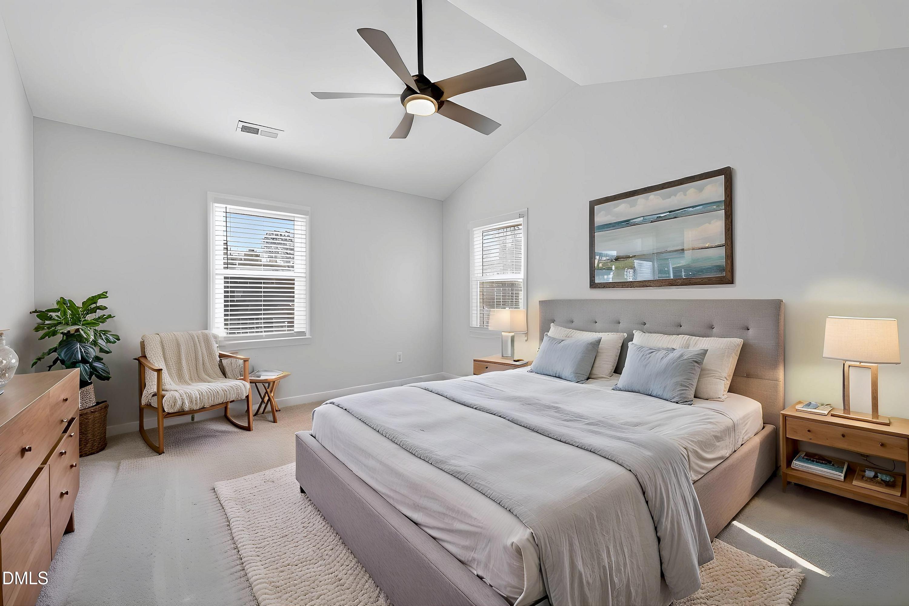 6009 Sweden Drive Raleigh, NC 27612 - Photo 17 of 38 a bedroom with a bed a couch and potted plant