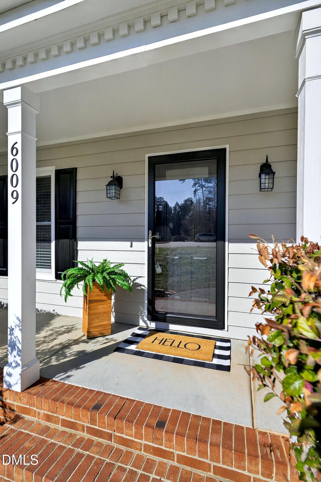 6009 Sweden Drive Raleigh, NC 27612 - Photo 2 of 38 a view of a door front of a house