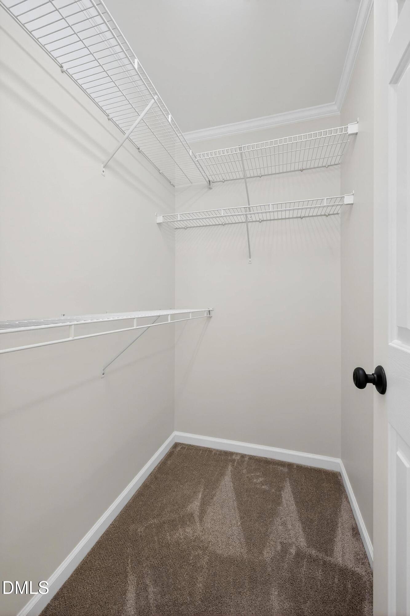 6009 Sweden Drive Raleigh, NC 27612 - Photo 22 of 38 a view of a room with racks on the wall