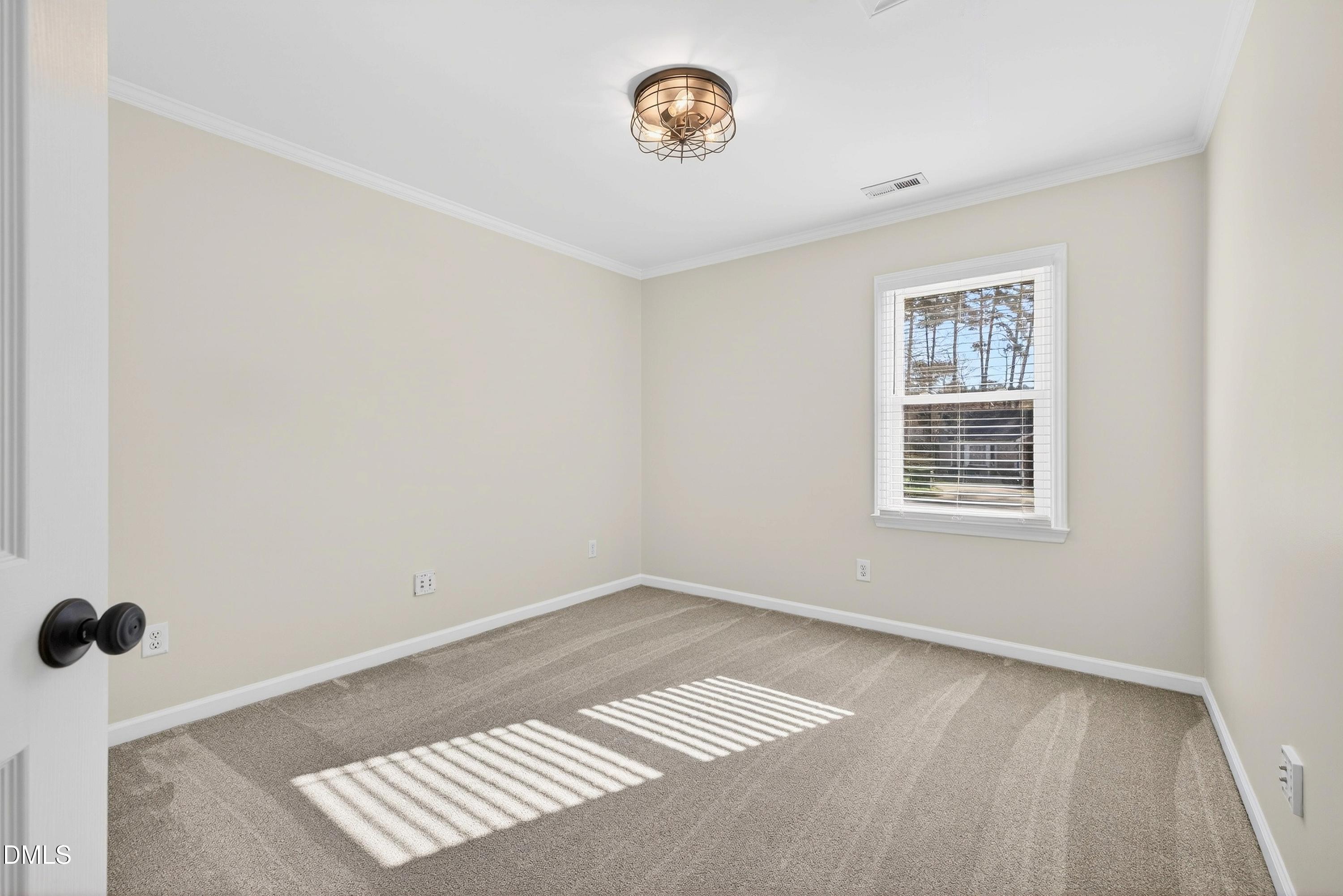 6009 Sweden Drive Raleigh, NC 27612 - Photo 23 of 38 a view of an empty room with a window