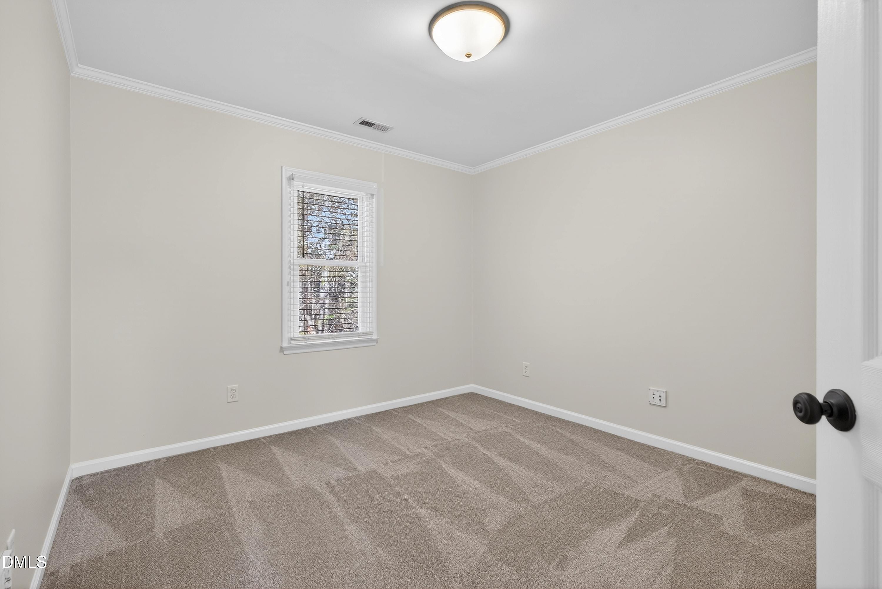 6009 Sweden Drive Raleigh, NC 27612 - Photo 28 of 38 an empty room with a window