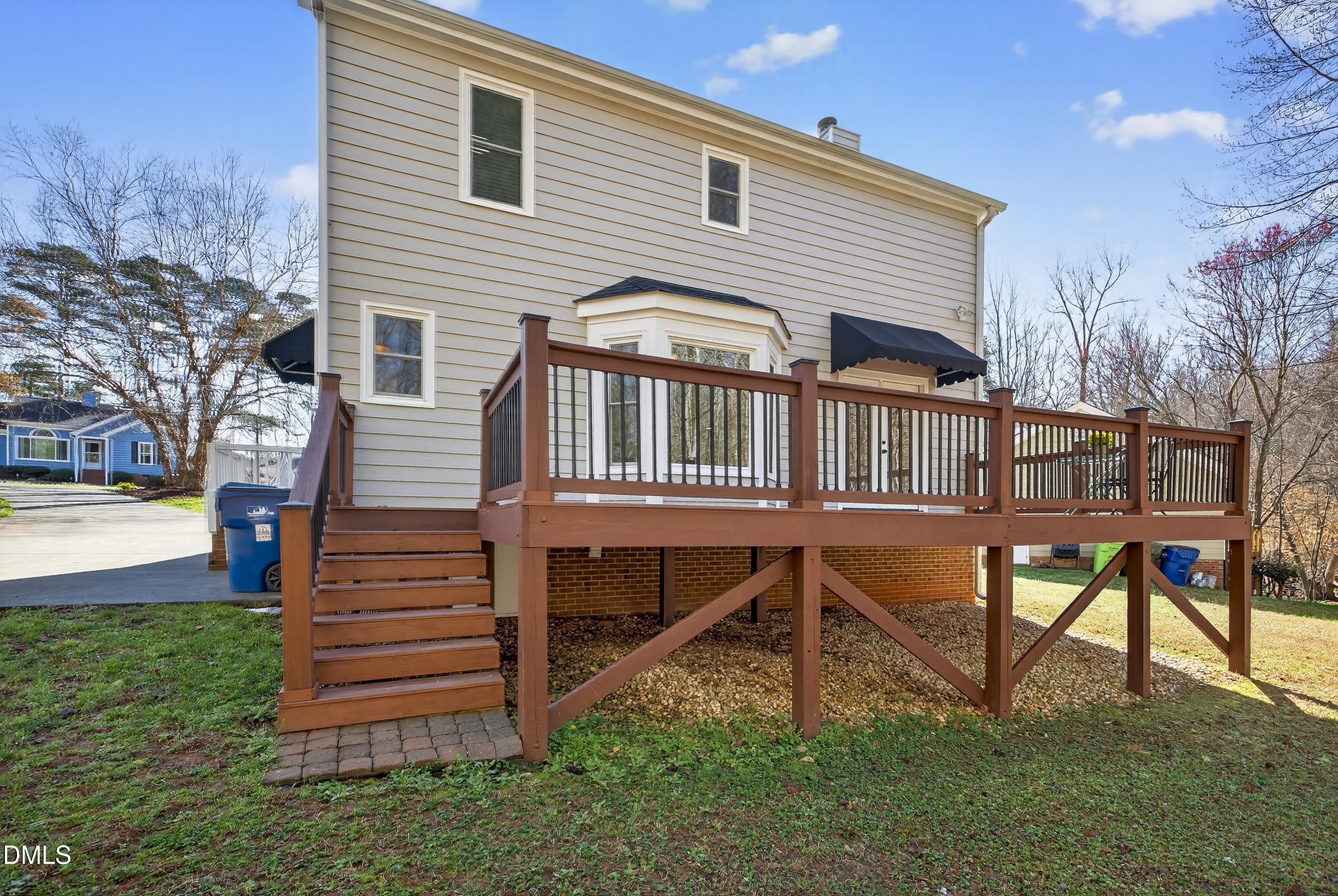 6009 Sweden Drive Raleigh, NC 27612 - Photo 33 of 38 a front view of a house with a yard and wooden fence