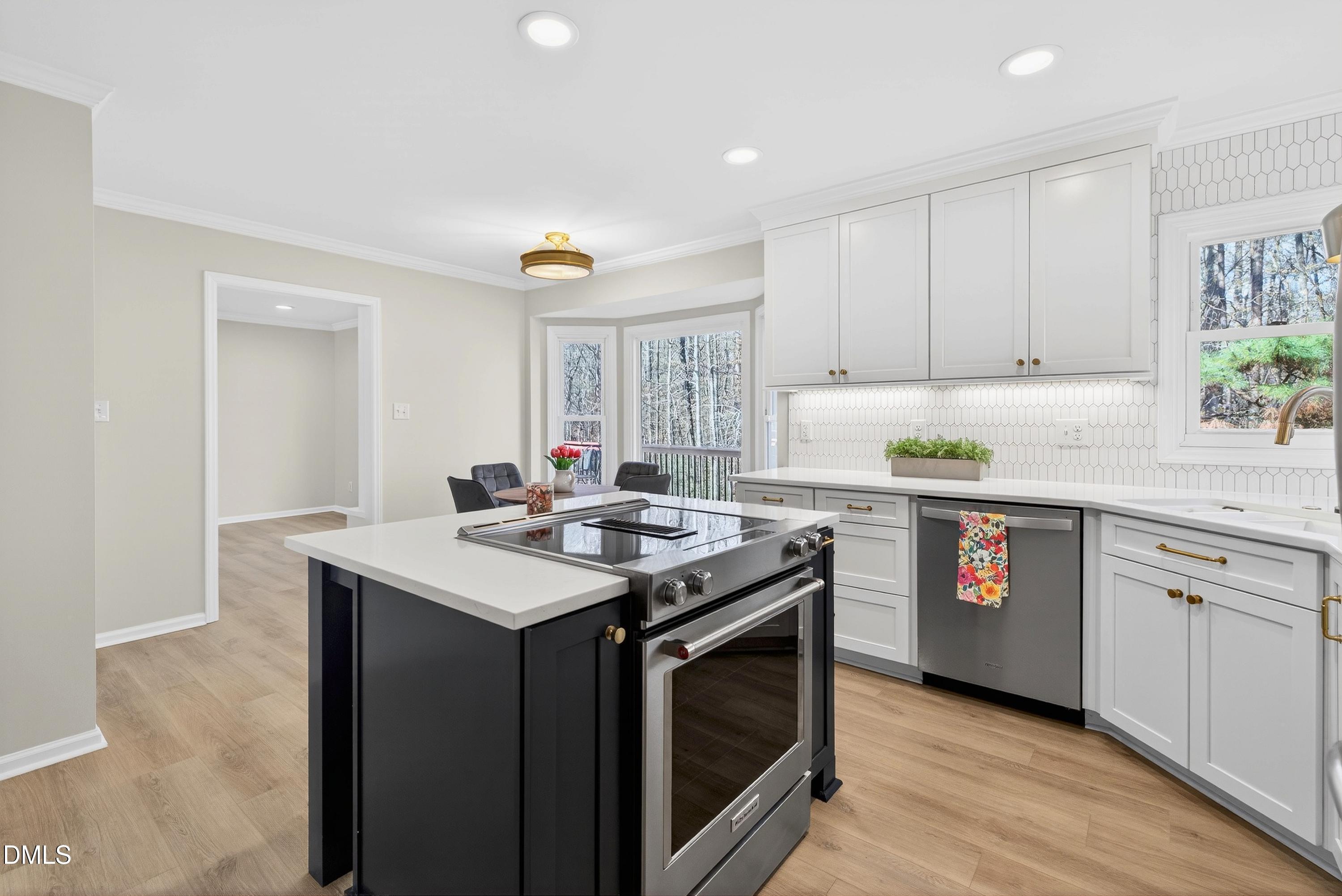 6009 Sweden Drive Raleigh, NC 27612 - Photo 8 of 38 a kitchen with a stove sink and window