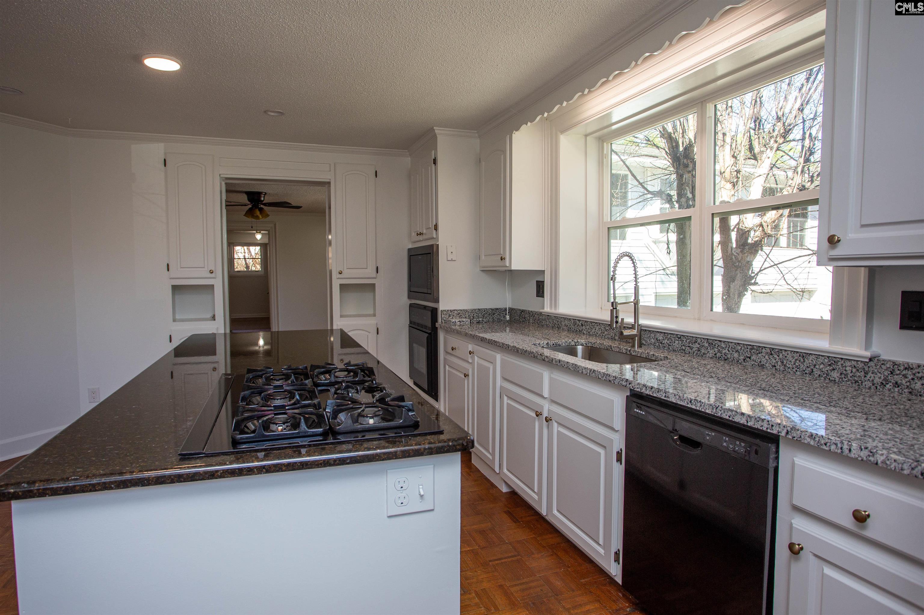 1700 Broad Street Camden, SC 29020 - Photo 11 of 41 a large kitchen with stainless steel appliances granite countertop a sink stove and cabinets