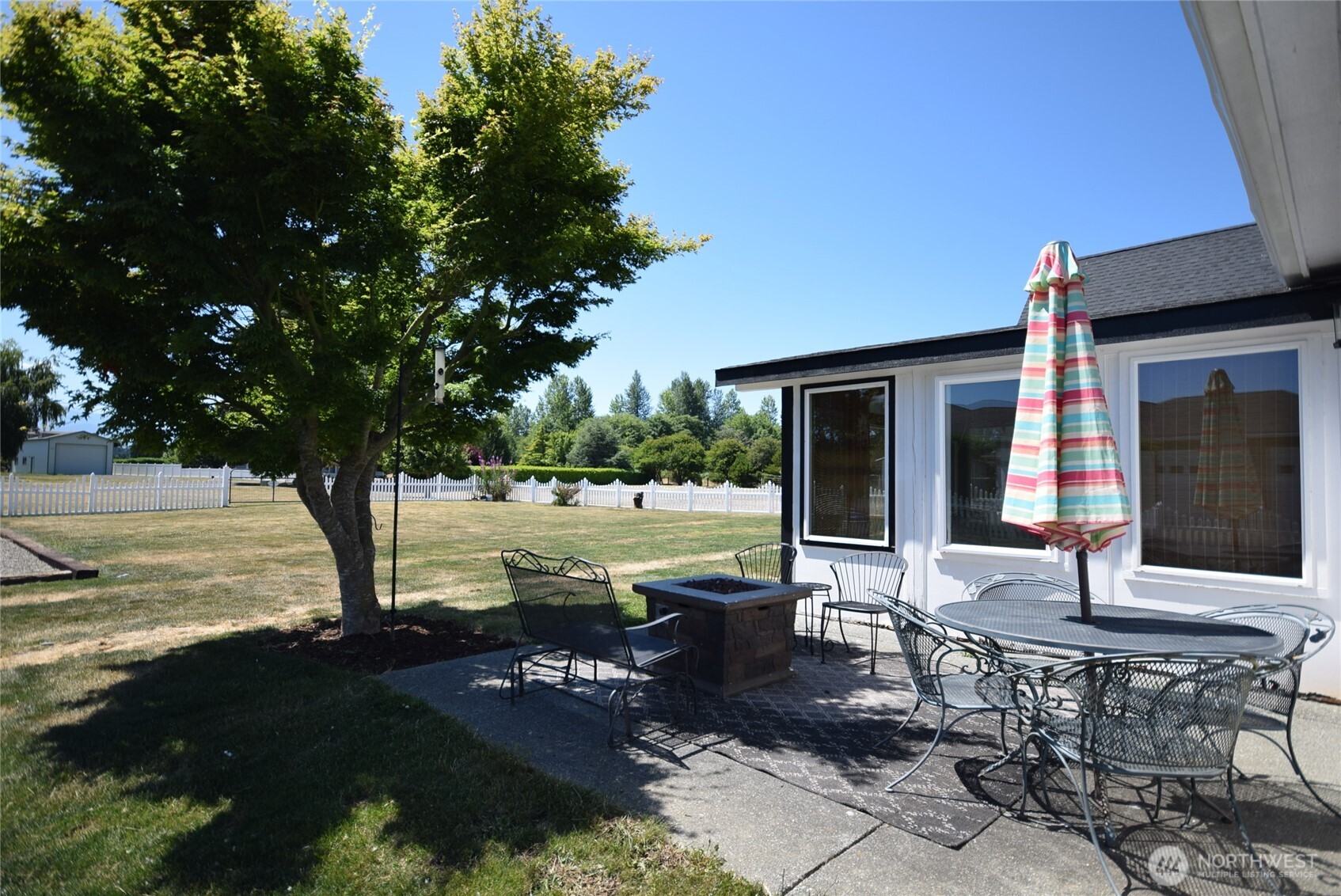 71 John Carl Road Sequim, WA 98382 - Photo 31 of 37 a view of a house with backyard porch and sitting area