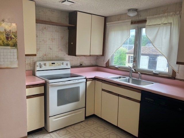 14 Birchwood Road Southwick, MA 01077 - Photo 14 of 25 a kitchen with a sink stove and cabinets
