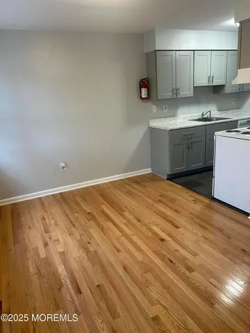 a view of kitchen with wooden floor