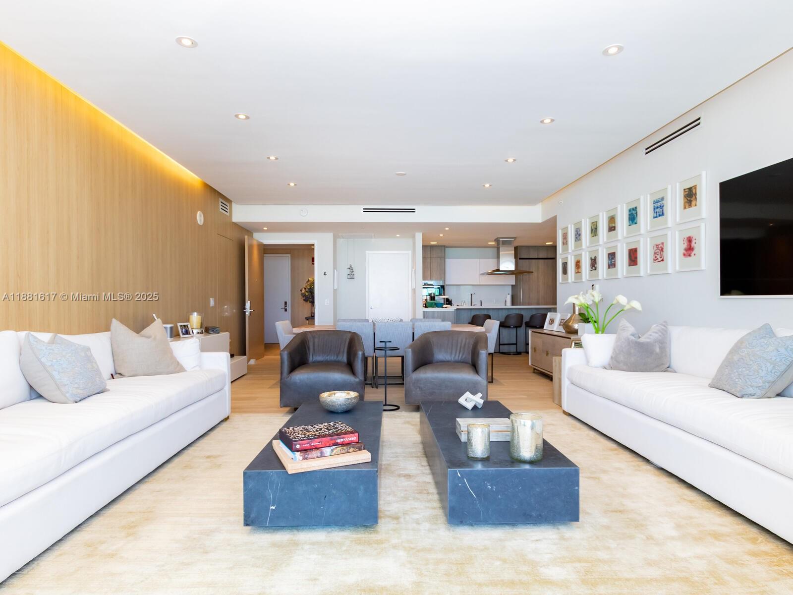 360 Ocean Drive, Unit 304S Key Biscayne, FL 33149 - Photo 13 of 40 a living room with furniture and a flat screen tv