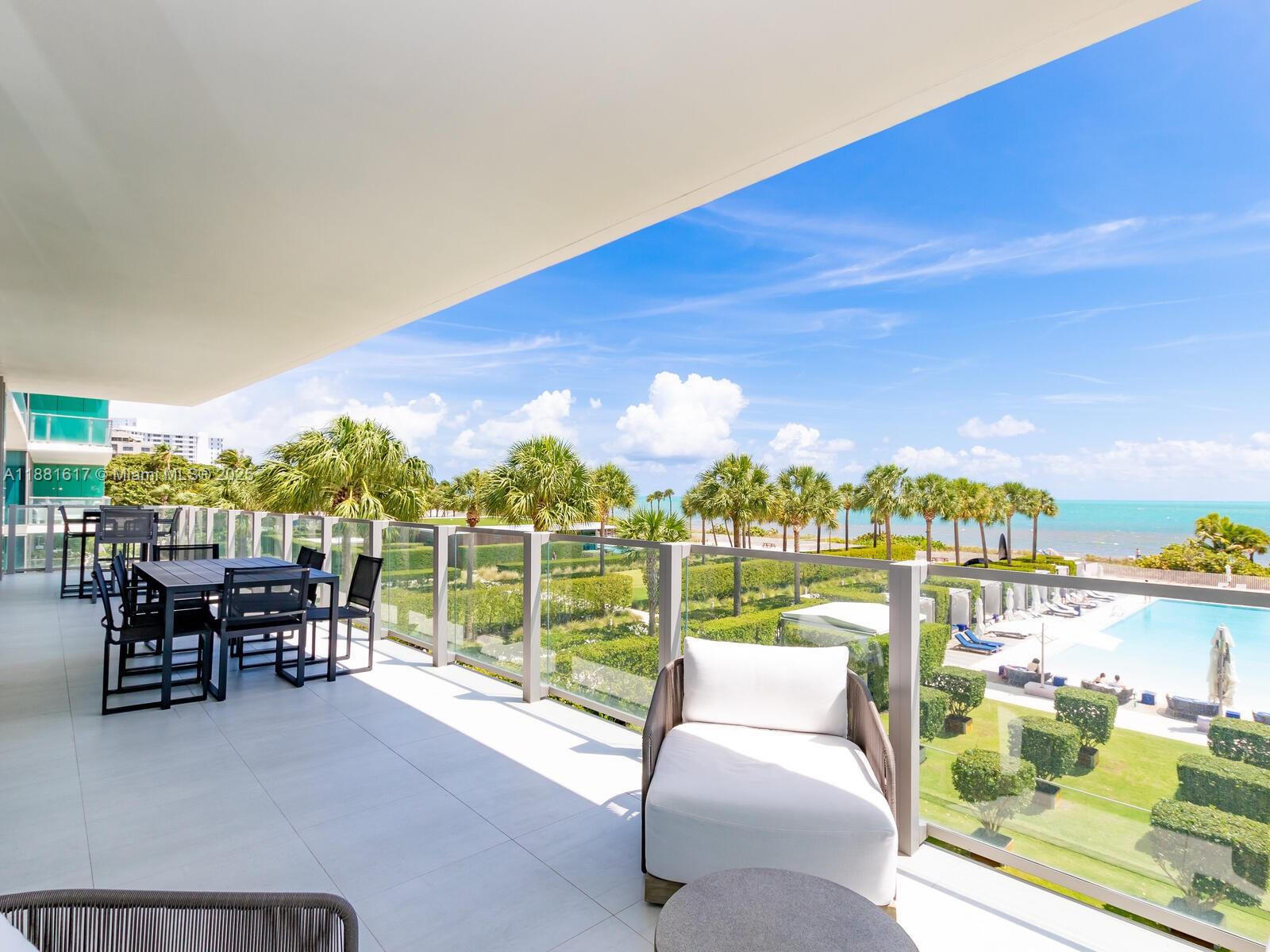 360 Ocean Drive, Unit 304S Key Biscayne, FL 33149 - Photo 2 of 40 a balcony with furniture and city view
