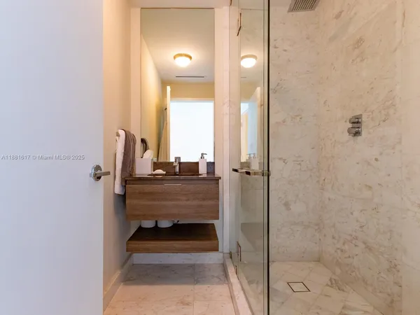 a bathroom with a sink and mirror