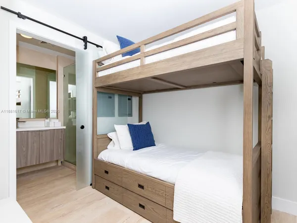 a bedroom with a bed and a dresser