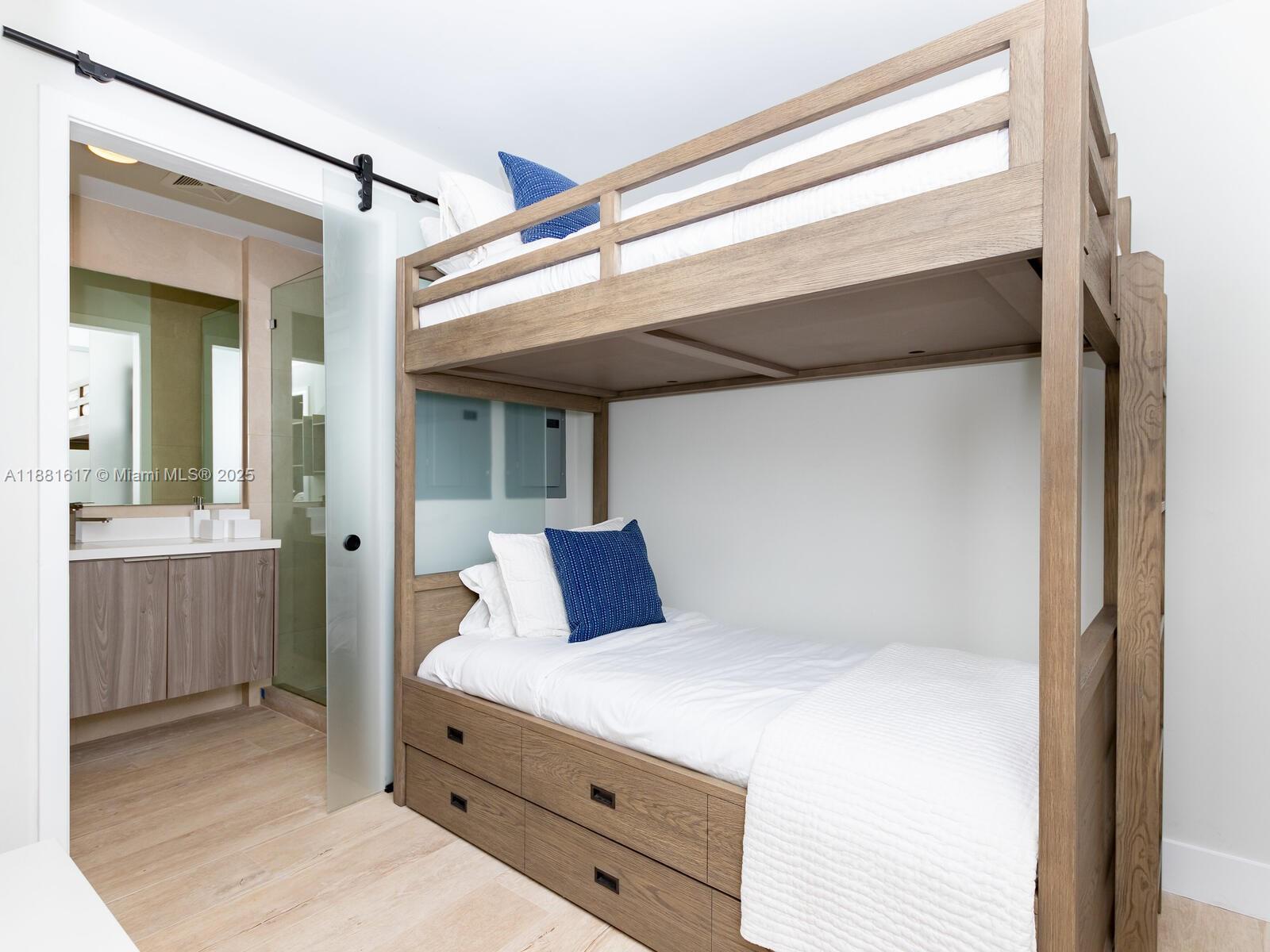 360 Ocean Drive, Unit 304S Key Biscayne, FL 33149 - Photo 24 of 40 a bedroom with a bed and a dresser