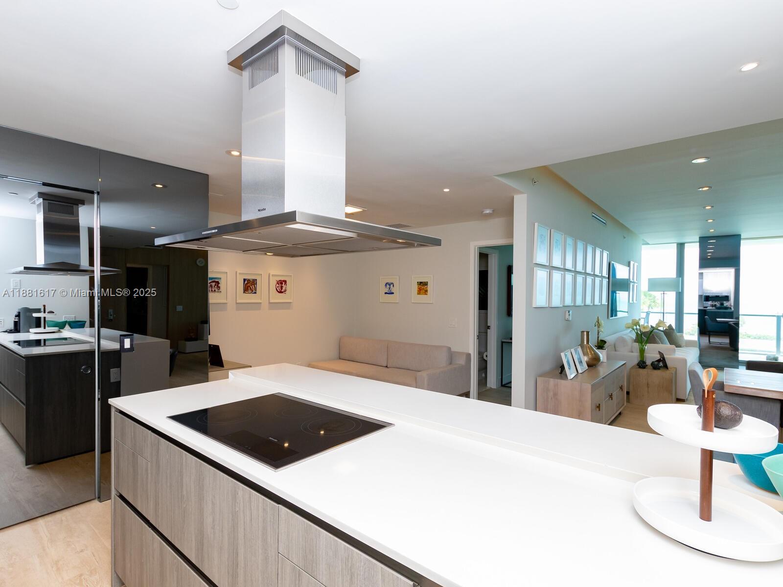 360 Ocean Drive, Unit 304S Key Biscayne, FL 33149 - Photo 33 of 40 a kitchen with stainless steel appliances granite countertop a sink a stove and a refrigerator