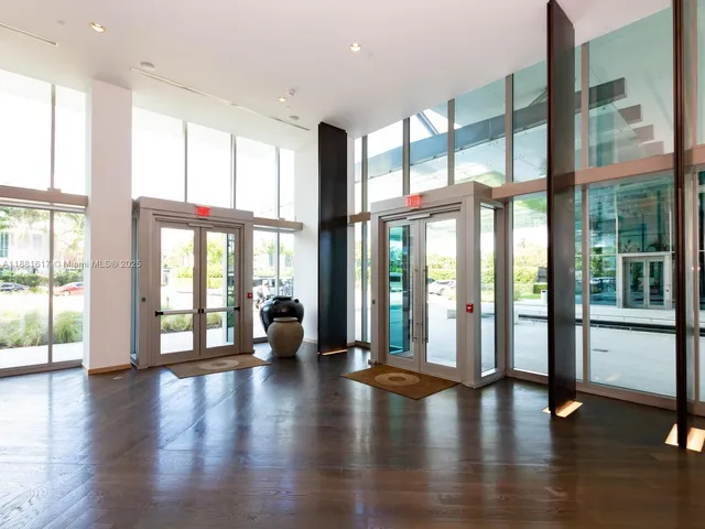 a view of an entryway with wooden floor