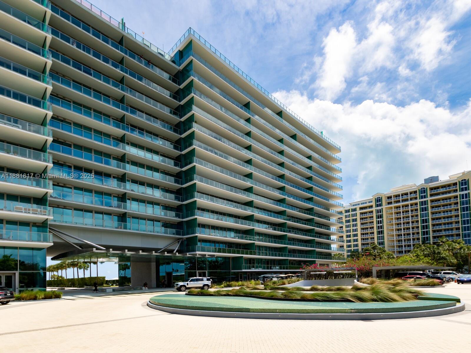 360 Ocean Drive, Unit 304S Key Biscayne, FL 33149 - Photo 40 of 40 a front view of a building with glass windows