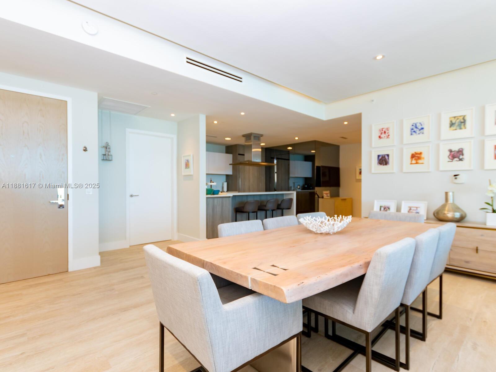 360 Ocean Drive, Unit 304S Key Biscayne, FL 33149 - Photo 7 of 40 a view of a dining room with furniture