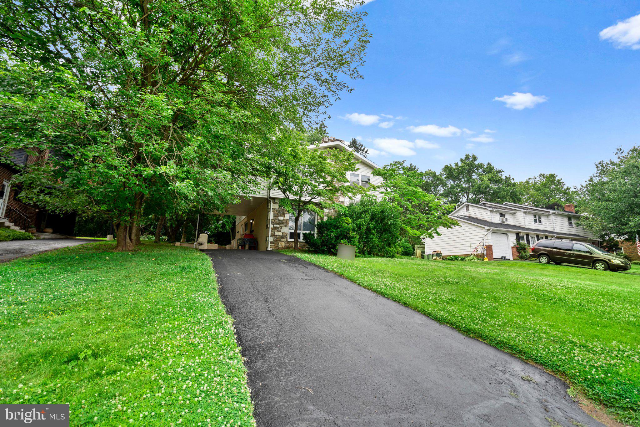 609 Foster Road Cheltenham, PA 19012 - Photo 4 of 44 Lush greenery surrounds a charming home.