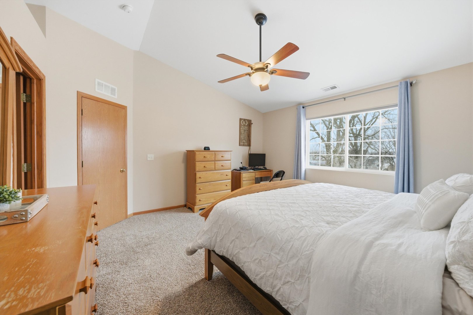 1110 Colonial Drive Joliet, IL 60432 - Photo 20 of 34 a bedroom with a bed and a chandelier