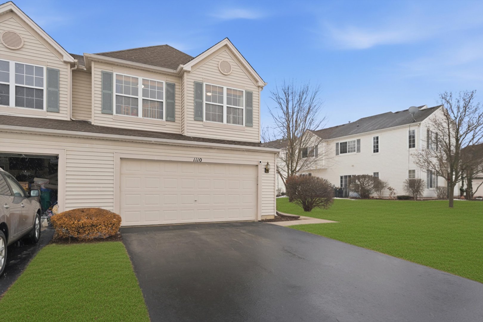 1110 Colonial Drive Joliet, IL 60432 - Photo 2 of 34 a front view of house with yard and green space