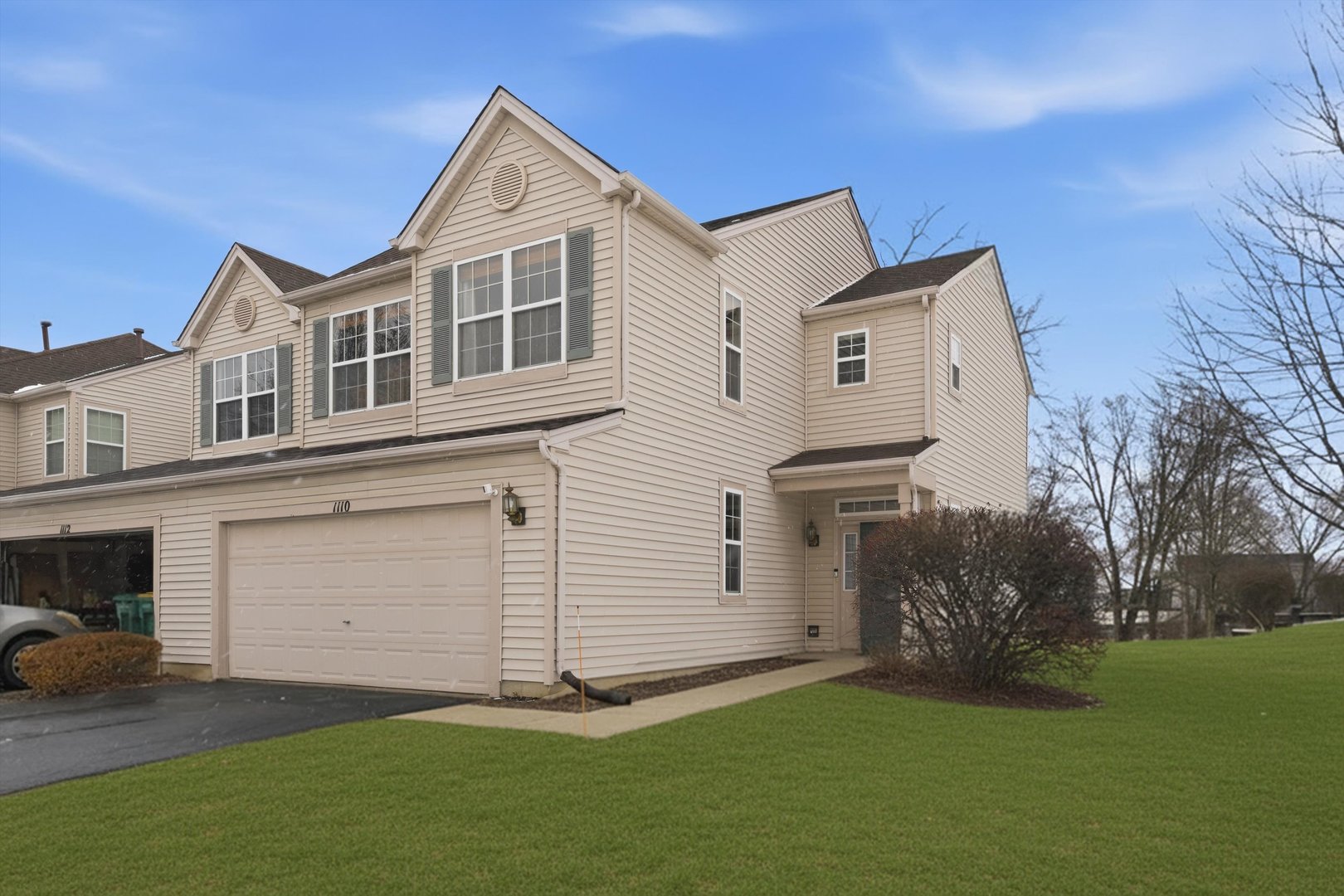 1110 Colonial Drive Joliet, IL 60432 - Photo 3 of 34 a front view of a house with a garden