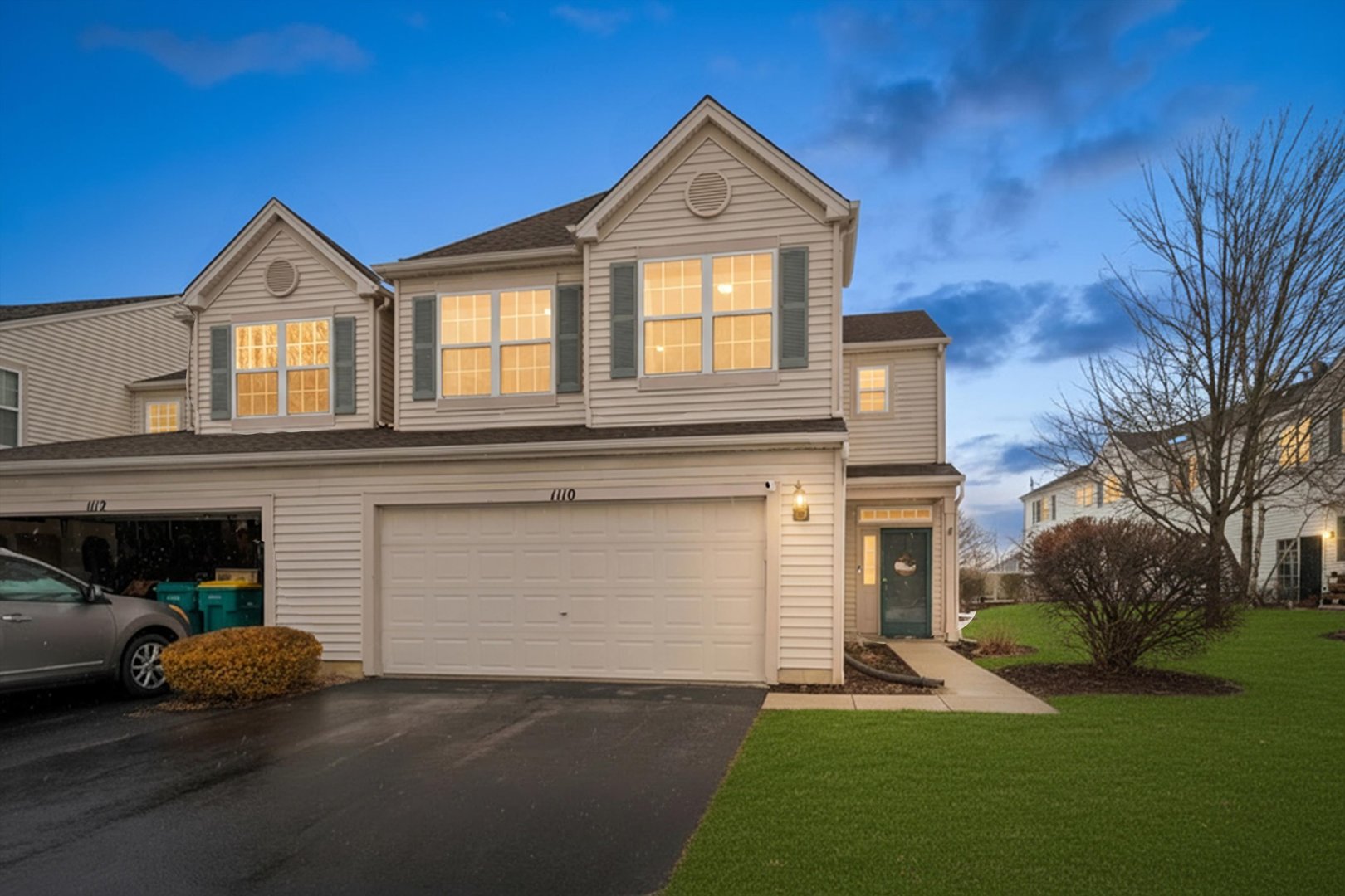 1110 Colonial Drive Joliet, IL 60432 - Photo 34 of 34 a front view of a house with a yard and garage