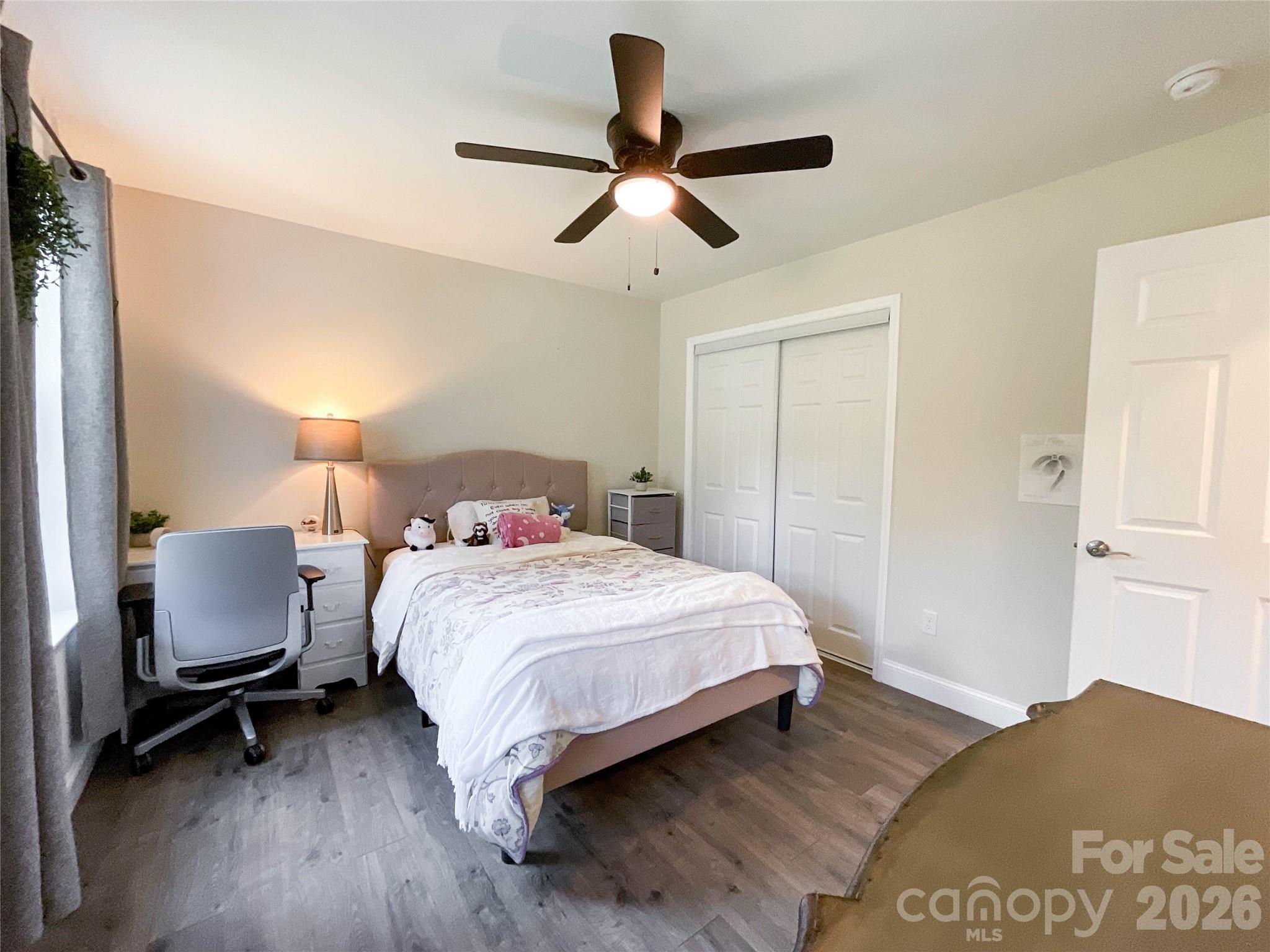 404 White Store Road Wadesboro, NC 28170 - Photo 8 of 38 a bedroom with a bed and a chair