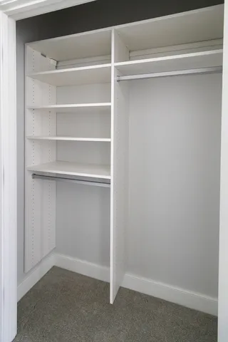 a view of an empty walk in closet