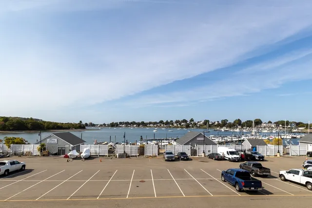 a view of a parking space and cars parked