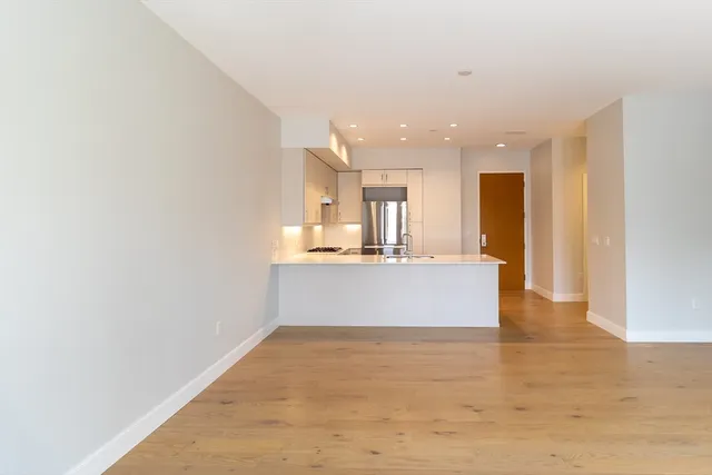 a view of kitchen and kitchen with windows